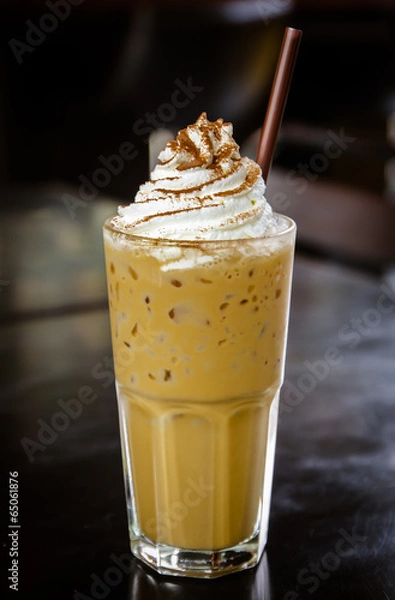 Obraz Iced coffee with whipped cream on the table.