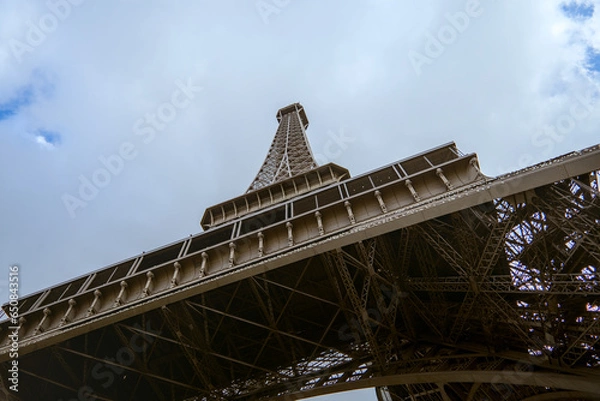 Fototapeta Paris, France - April 3 2019: View on Eiffel Tower in Paris from below