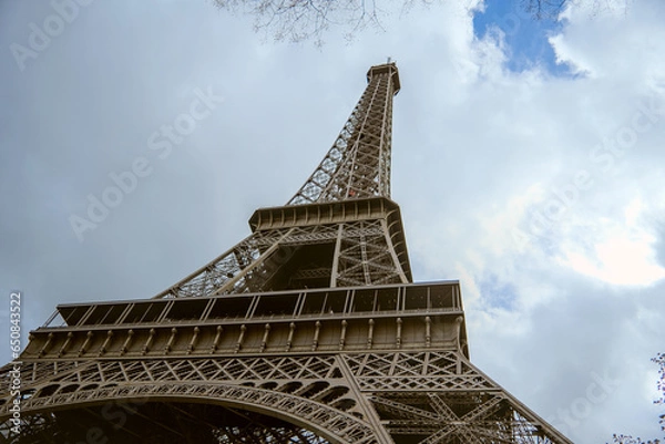 Fototapeta Paris, France - April 3 2019: View on Eiffel Tower in Paris from below