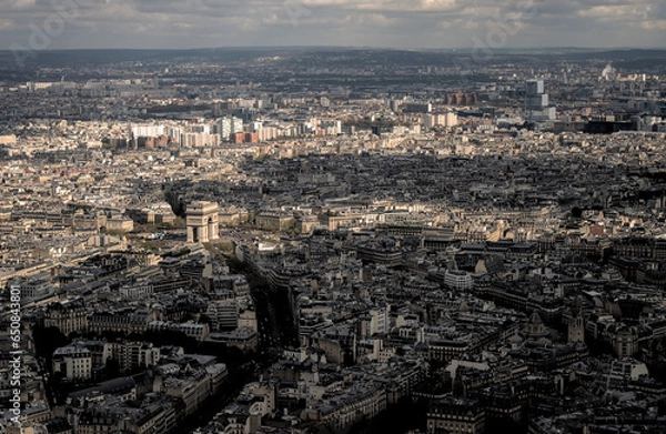Fototapeta Paris, France - April 3 2019: The arc de triomphe from the eiffel tower over the streets of Paris on a clear day