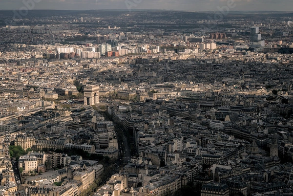 Fototapeta Paris, France - April 3 2019: The arc de triomphe from the eiffel tower over the streets of Paris on a clear day