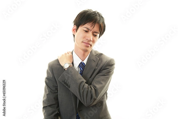 Fototapeta 肩痛を訴えるビジネスマン