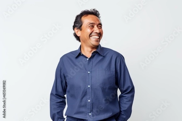 Obraz Group portrait photography of a cheerful Peruvian man in his 40s against a white background