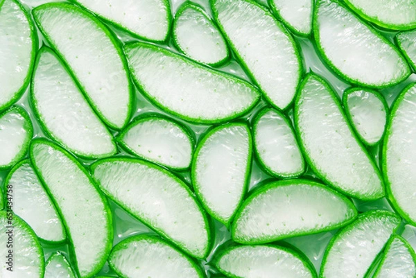 Obraz Fresh aloe vera slice soak in aloe vera gel texture for background , top view , flat lay.