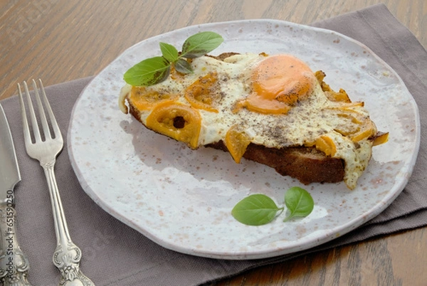 Fototapeta open sandwich with egg and yellow tomato