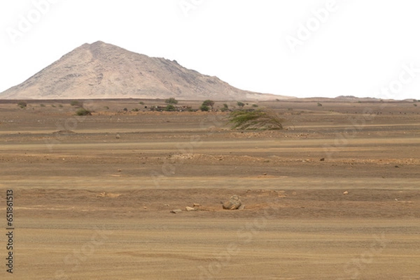 Fototapeta Rocky desert landscape with mountain in the background and transparent sky. Background suitable for 3D compositing