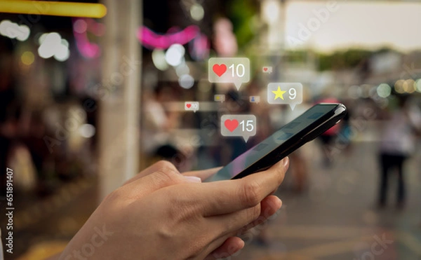Fototapeta Hands holding smartphone with using a social media on mobile, typing message and comment to communicate.