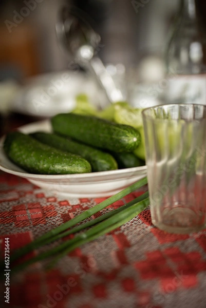 Fototapeta cucumber on a dining table