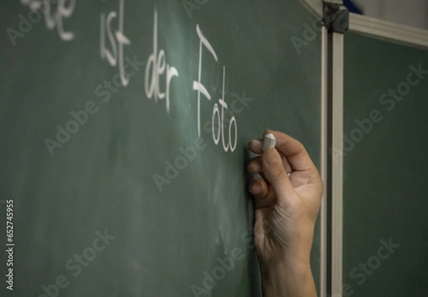 Obraz hand writing on a blackboard