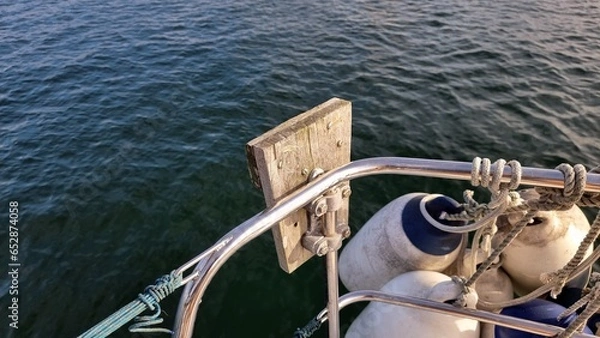 Fototapeta Outboard bracket on rail of sailing yacht