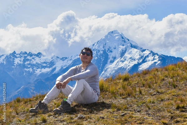Fototapeta Happy man on top of mountain watching the snowy Veronica on the way from Intipunku to Perolniyoc Cusco, Ollantaytambo