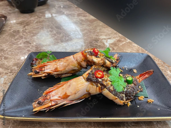 Fototapeta Grilled shrimp topped with tamarind sauce and chilli.