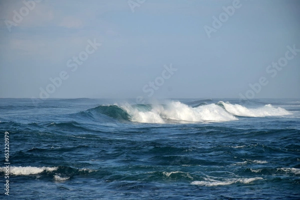 Fototapeta beach waves on a sunny morning, beach waves break the calm on the beach