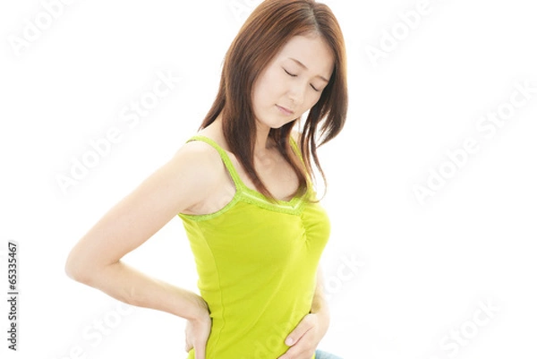 Fototapeta 腰痛を訴える女性