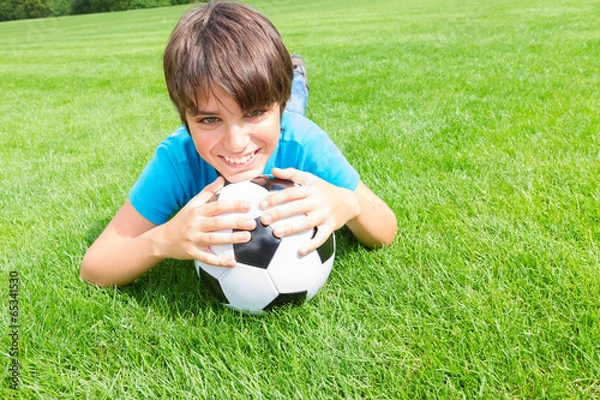 Fototapeta boy holding football ball