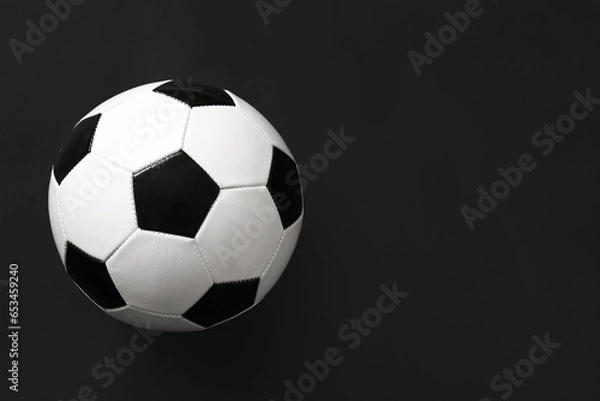 Fototapeta Soccer ball on dark  background