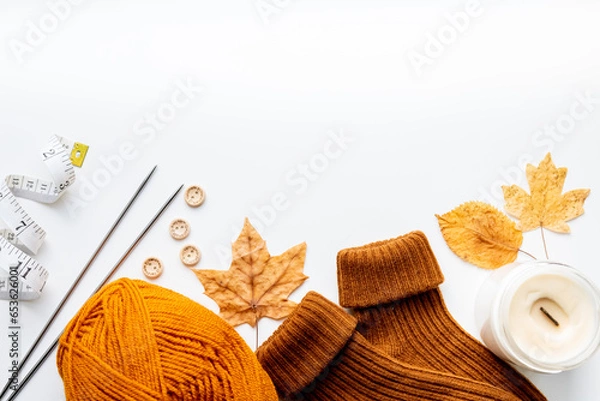 Obraz Set for knitting children's socks. Orange threads, knitting needles, buttons, centimeter.