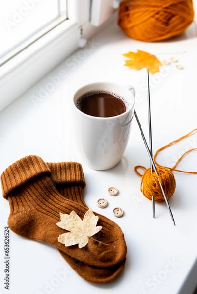 Obraz Set for knitting children's socks. Orange threads, knitting needles, buttons, centimeter.