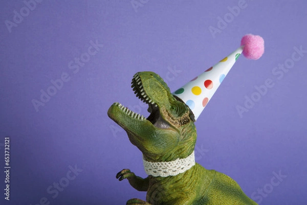 Obraz violet a dinosaur, dressed up in lace and a paper party hat