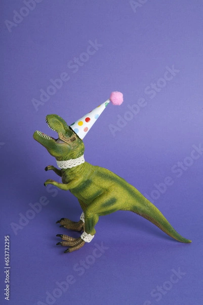 Obraz violet a dinosaur, dressed up in lace and a paper party hat