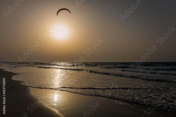 Obraz Kite surfing sunset alone in the ocean High-quality photo