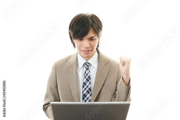 Fototapeta ガッツポーズのビジネスマン