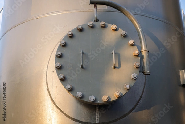 Obraz Man hole of tank and bona pipe on the power plant project. The photo is suitable to use for industry background photography, power plant poster and electricity content media.