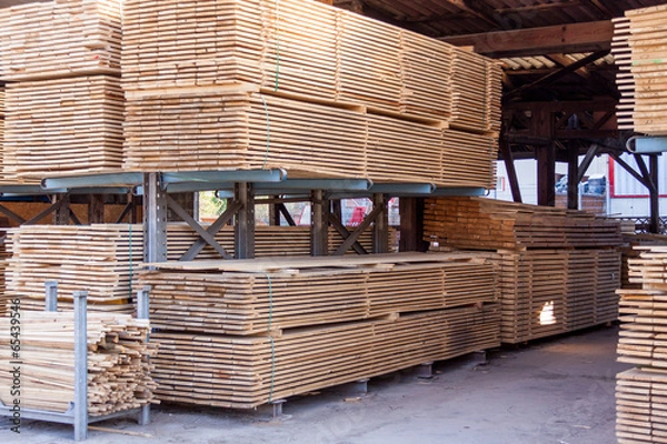 Fototapeta Wooden panels stored inside a warehouse