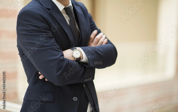 Fototapeta Business person talking on the phone, having a job interview, doing analysis with a tablet, and doing a job evaluation with a laptop.