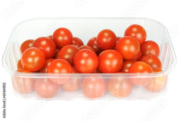 Obraz Cherry tomatoes in a plastic container on white background