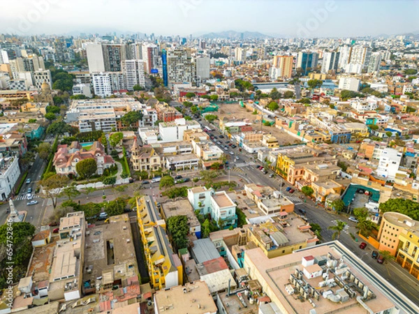 Fototapeta Aerial view of the Barranco neighborhood in Lima, Peru in 2023. Spanish colonial style historic buildings. Neighborhood with new houses and also many houses degraded by time. Gastronomic region 