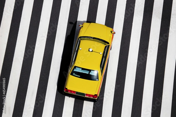 Obraz Japanese taxi running over crosswalks