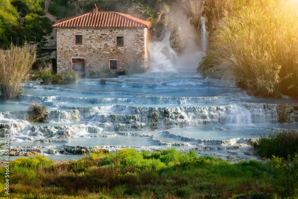 Fototapeta Empty natural spa with turquoise water at Saturnia thermal baths, in Tuscany, Italy. Le Cascate del Mulino is a perfect place to relax in waterfalls and hot springs.