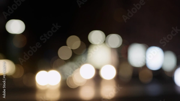 Fototapeta Bokeh background of night city with car light passing by