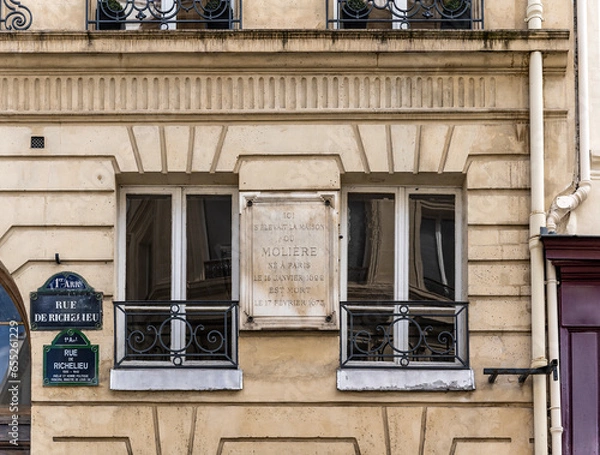 Fototapeta Plaque pointing the building in which playwright Moliere lived and died in rue Moliere, Paris city centre, France