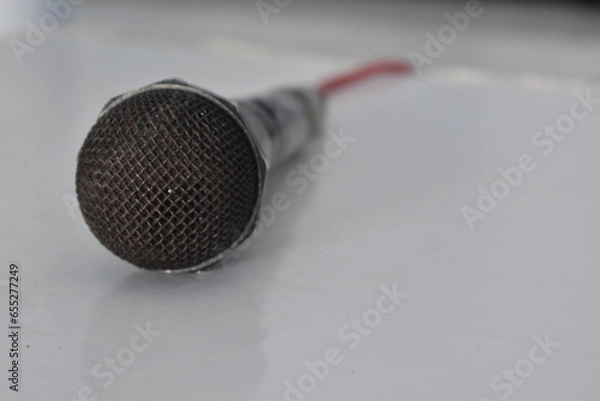 Fototapeta Zoom microphone photo lying on a white table