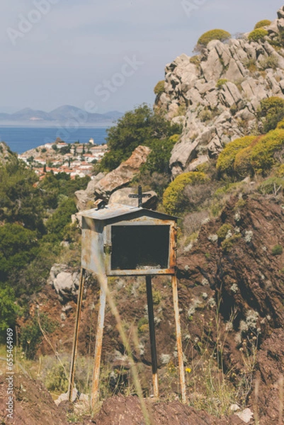 Fototapeta Top view of the island Hydra, a Greek island. With a small box in the middle of the mountain dedicated to the Madonna 	