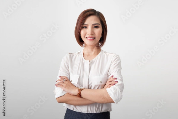 Obraz Portrait of beautiful young woman in white blouse on light grey background