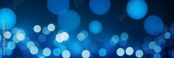 Fototapeta Blue bokeh lights on a blue background banner. Abstract blue background. Blue light dots banner.