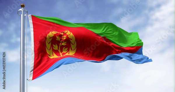 Fototapeta Eritrea national flag waving on a clear day