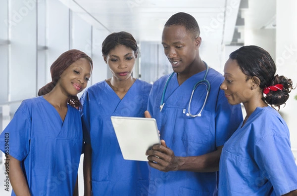 Obraz African physician team with tablet PC