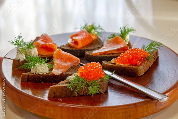 Fototapeta toast with salmon and caviar