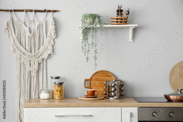 Fototapeta Interior of light kitchen with counter and shelf