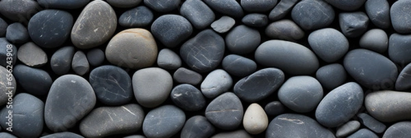 Fototapeta black smooth oval pebbles background