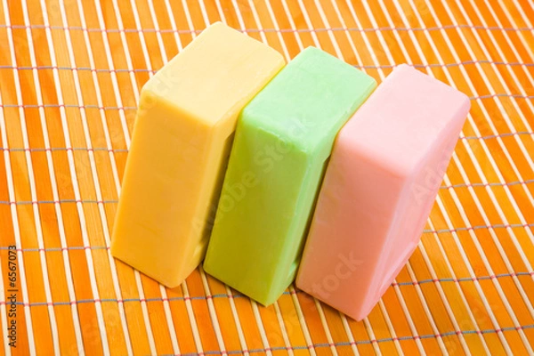 Obraz Soap on the bamboo table-cloth