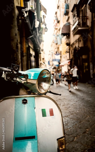 Fototapeta Old scooter in a downtown street of Naples with an italian flag on it