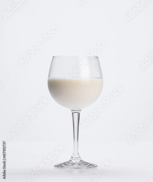 Fototapeta goblet full of fresh milk on a white background