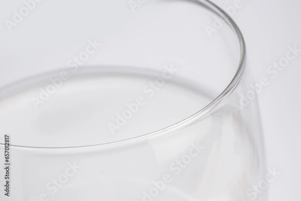 Fototapeta fresh milk in glass cup in close-up on white background taken from above