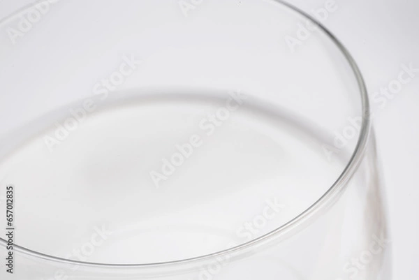 Fototapeta fresh milk in glass cup in close-up on white background taken from above