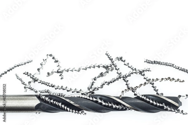 Fototapeta Drill and metal shavings on white